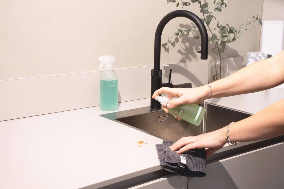 Side-by-side comparison: conventional wipes list chemicals like phenoxyethanol and PEG-40; all natural cleaning wipes show water, organic aloe, chamomile extract, and biodegradable cellulose
