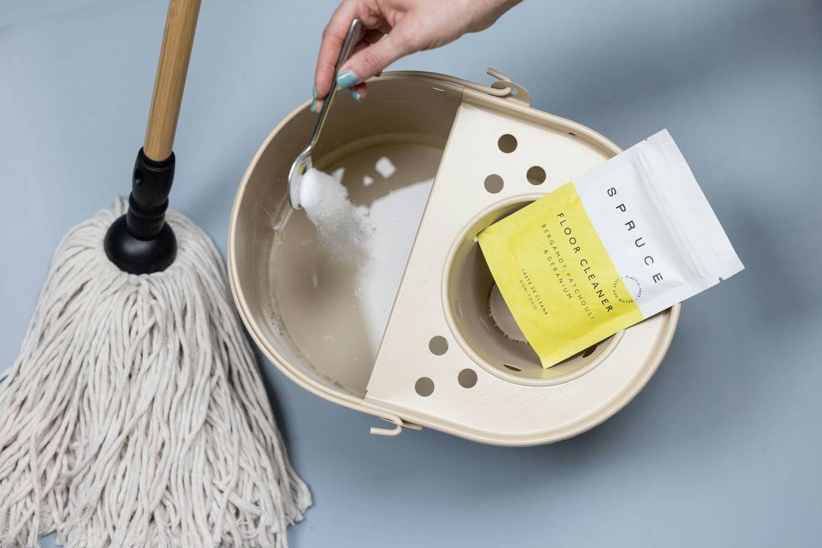 Side-by-side comparison of ingredient lists: conventional 'natural' wipe vs. certified organic routine clean cleaning wipe showing hidden irritants like fragrance and alcohol denat in the former, and simple plant-based components in the latter