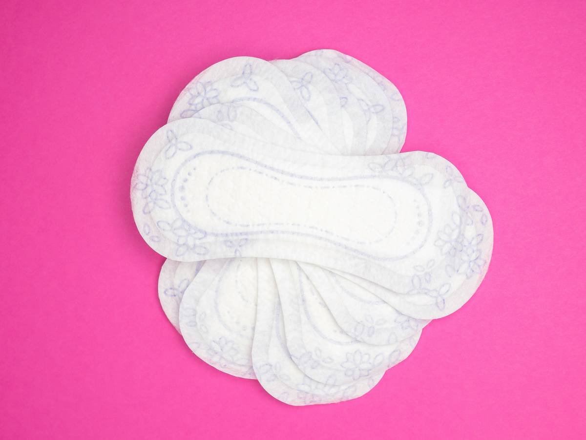 woman using gentle cleansing wipes cetaphil on face with calm expression